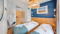 Posteľ alebo postele v izbe v ubytovaní Apartamenty Sun & Snow Port Krynica przy porcie i promenadzie