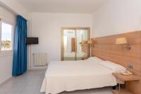 Postel nebo postele na pokoji v ubytování Hotel Ibiza Playa