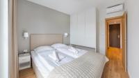 Posteľ alebo postele v izbe v ubytovaní Apartamenty Sun & Snow Port Krynica przy porcie i promenadzie