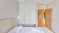 Posteľ alebo postele v izbe v ubytovaní Apartamenty Sun & Snow Port Krynica przy porcie i promenadzie