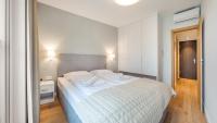 Posteľ alebo postele v izbe v ubytovaní Apartamenty Sun & Snow Port Krynica przy porcie i promenadzie