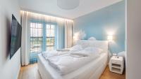 Posteľ alebo postele v izbe v ubytovaní Apartamenty Sun & Snow Port Krynica przy porcie i promenadzie
