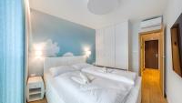 Posteľ alebo postele v izbe v ubytovaní Apartamenty Sun & Snow Port Krynica przy porcie i promenadzie