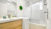 a white bathroom with a sink and a shower at Homey AWAY - Centre-ville &#47; Au Calme &#47; Proche des transports pour Genève in Annemasse