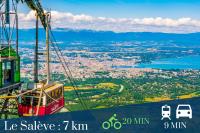 a gondola ride in the sky over a city at Homey AWAY - Centre-ville &#47; Au Calme &#47; Proche des transports pour Genève in Annemasse