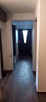 an empty hallway with a window in a building at GM Place apartment 60 m2 in Gornji Milanovac