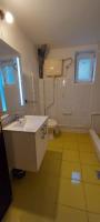 a bathroom with a sink and a toilet at GM Place apartment 60 m2 in Gornji Milanovac