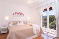 Łóżko lub łóżka w pokoju w obiekcie Apartment Katarina Vrboska