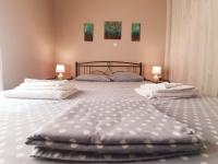 A bed or beds in a room at Ilias' cosy and relaxing apartment