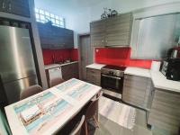A kitchen or kitchenette at Ilias' cosy and relaxing apartment