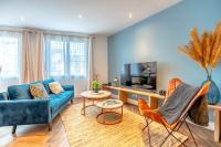 Televízia a/alebo spoločenská miestnosť v ubytovaní Superbe appartement neuf, climatisé centre village