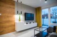 Telewizja i/lub zestaw kina domowego w obiekcie Nowoczesny apartament Ludova