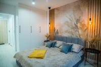 Łóżko lub łóżka w pokoju w obiekcie Nowoczesny apartament Ludova