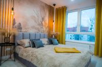 Łóżko lub łóżka w pokoju w obiekcie Nowoczesny apartament Ludova