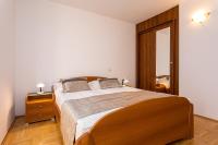 Postel nebo postele na pokoji v ubytování Apartments Crnekovic I Zarok