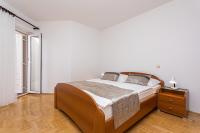 Postel nebo postele na pokoji v ubytování Apartments Crnekovic I Zarok