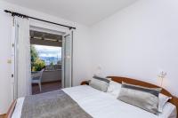 Postel nebo postele na pokoji v ubytování Apartments Crnekovic I Zarok