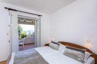Postel nebo postele na pokoji v ubytování Apartments Crnekovic I Zarok
