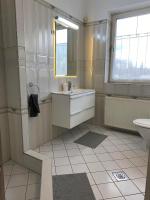 Kúpeľňa v ubytovaní Hermina apartmanház