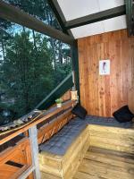 a sauna with a bench in a wooden cabin at Le Cocon Cap Forêt in Lège-Cap-Ferret