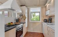Kuchyň nebo kuchyňský kout v ubytování Holiday Home Lærkemose Sydals X