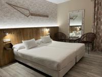 Posteľ alebo postele v izbe v ubytovaní Alameda Hostal Boutique