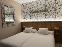 Posteľ alebo postele v izbe v ubytovaní Alameda Hostal Boutique