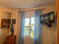 Televízia a/alebo spoločenská miestnosť v ubytovaní Apartamento en Costa Ballena, Urb. Playa Ballena