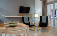 Televízia a/alebo spoločenská miestnosť v ubytovaní Novam Loft Terrace Centro Málaga