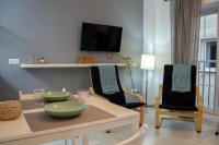 Televízia a/alebo spoločenská miestnosť v ubytovaní Novam Loft Terrace Centro Málaga