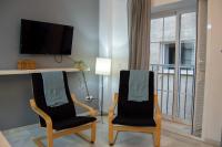 Televízia a/alebo spoločenská miestnosť v ubytovaní Novam Loft Terrace Centro Málaga