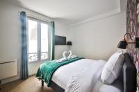 Łóżko lub łóżka w pokoju w obiekcie 2.Luxueux Duplex 6/8pers/Full Equipped/République