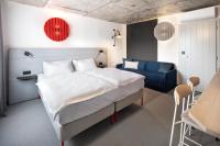 Postel nebo postele na pokoji v ubytování Boutique Hotel Mezi švy