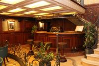 a bar in a building with wooden walls and ceilings at Royal San Marco Hotel in Venice