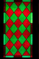 a stained glass window with red and green colors at Cortijo La Hoya in El Bujeo