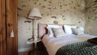 A bed or beds in a room at Podere Le Vedute