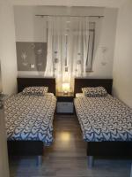 Posteľ alebo postele v izbe v ubytovaní Lavender Apartments