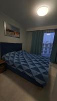 Posteľ alebo postele v izbe v ubytovaní Apartament Holiday 32