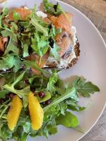 a white plate with a salad with fish and vegetables at Jackson's Falls Country Inn in Milford