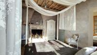 A bed or beds in a room at Podere Le Vedute