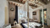 A bed or beds in a room at Podere Le Vedute
