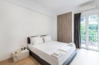 Posteľ alebo postele v izbe v ubytovaní Downtown City Apartment