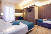 A bed or beds in a room at Hotel Mediterranée
