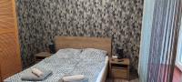 Posteľ alebo postele v izbe v ubytovaní Lugas Apartman