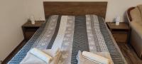 Posteľ alebo postele v izbe v ubytovaní Lugas Apartman