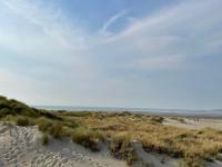 a beach with sand dunes and the ocean in the background at Le Metz, Duplex, 2 Chambres in Le Touquet-Paris-Plage
