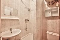 a white bathroom with a sink and a toilet at Charmant studio Paris 3 Marais in Paris