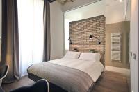 A bed or beds in a room at Atypical Rooms