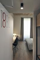 A bed or beds in a room at Atypical Rooms
