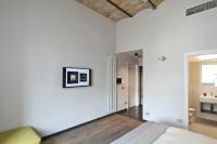 A bed or beds in a room at Atypical Rooms